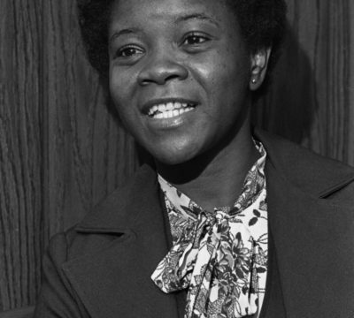 An old portrait of Shirley sitting in her D.C. office.