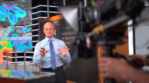 Tom Niziol reporter on the weather at The Weather Channel's studio 